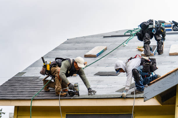 Professional Gutter Installation technician working in Lawrence, MA